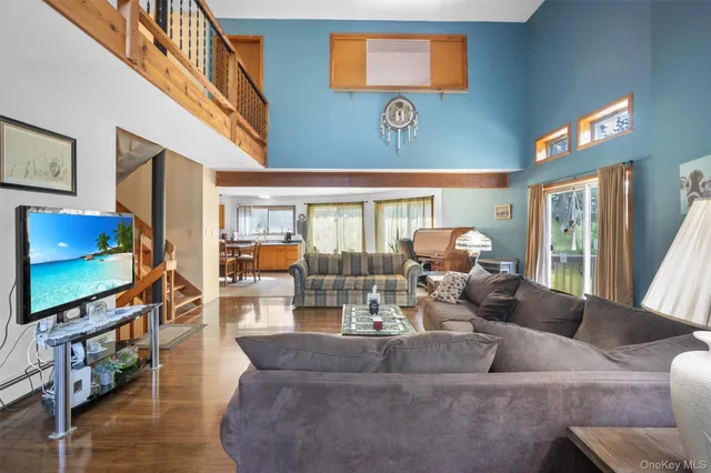 a living room with fireplace furniture and a flat screen tv