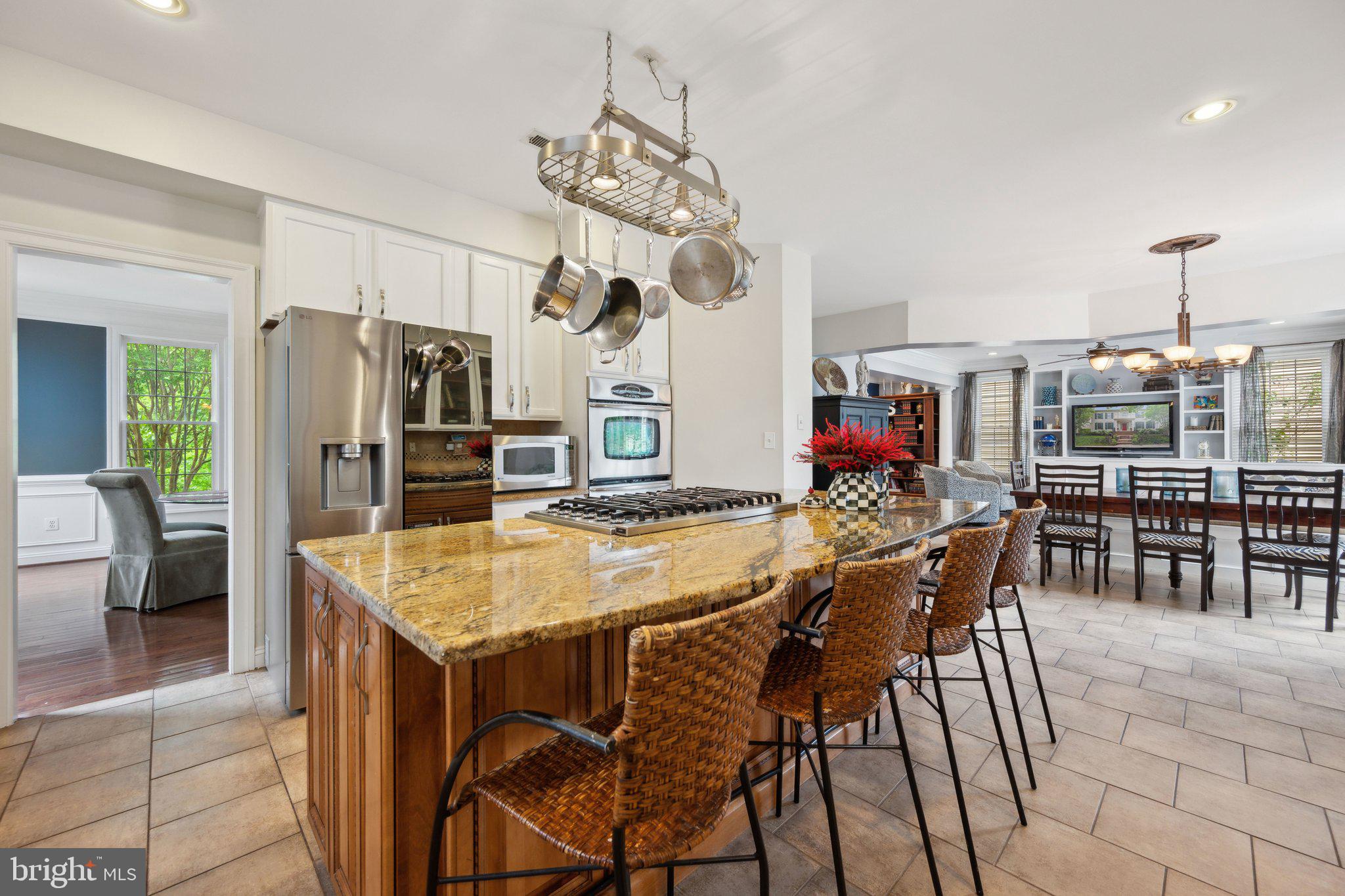 304 Thompson Dairy Way Rockville, MD 20850 - Photo 12 of 42 a view of a dining room with furniture and a chandelier
