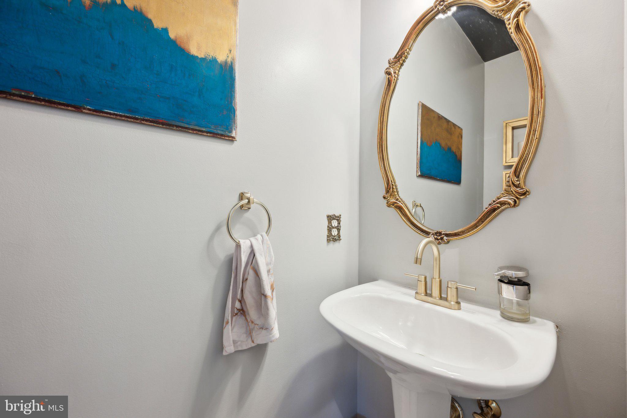 304 Thompson Dairy Way Rockville, MD 20850 - Photo 15 of 42 a bathroom with a sink and a mirror