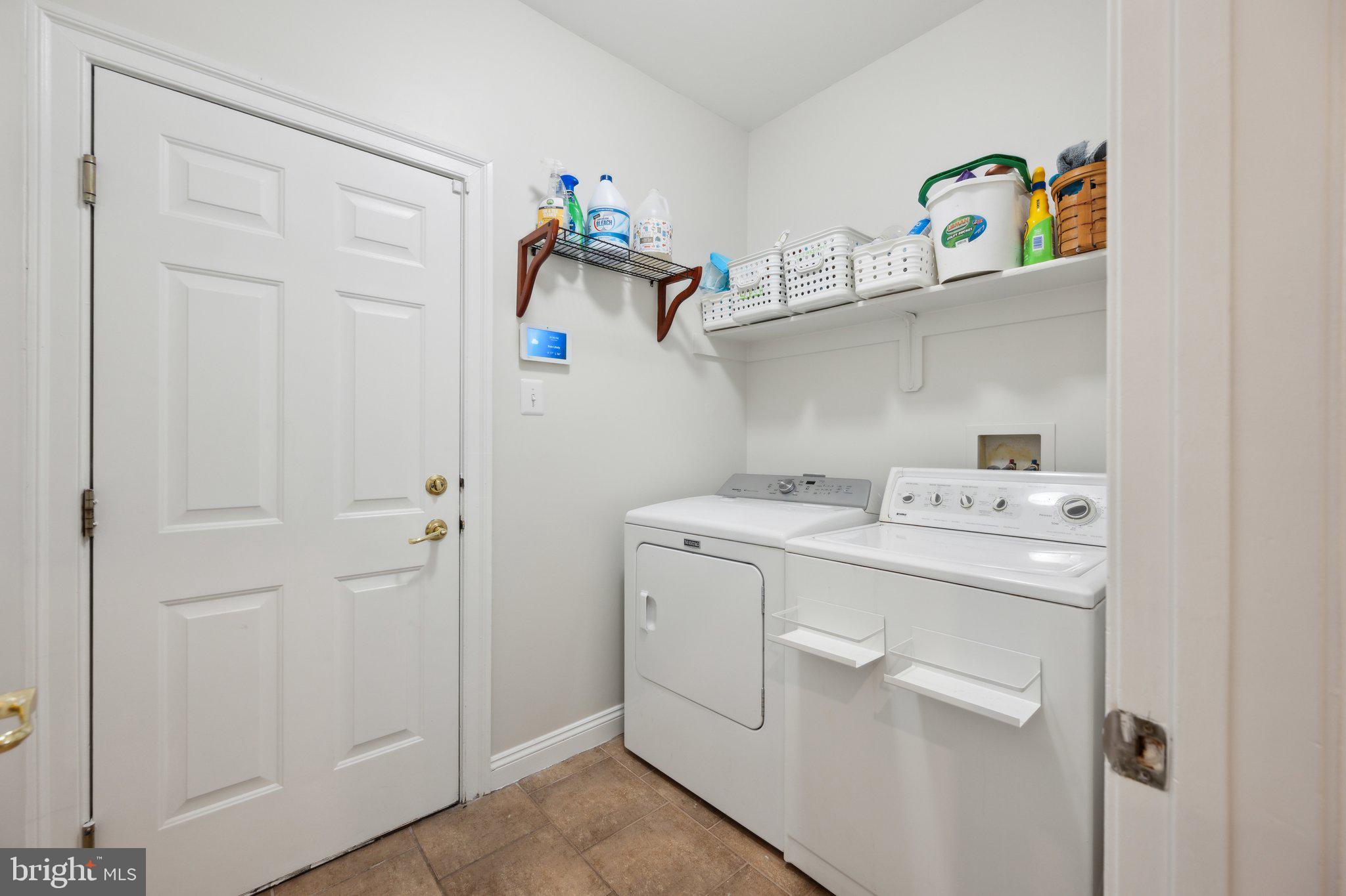 304 Thompson Dairy Way Rockville, MD 20850 - Photo 16 of 42 a utility room with dryer and washer