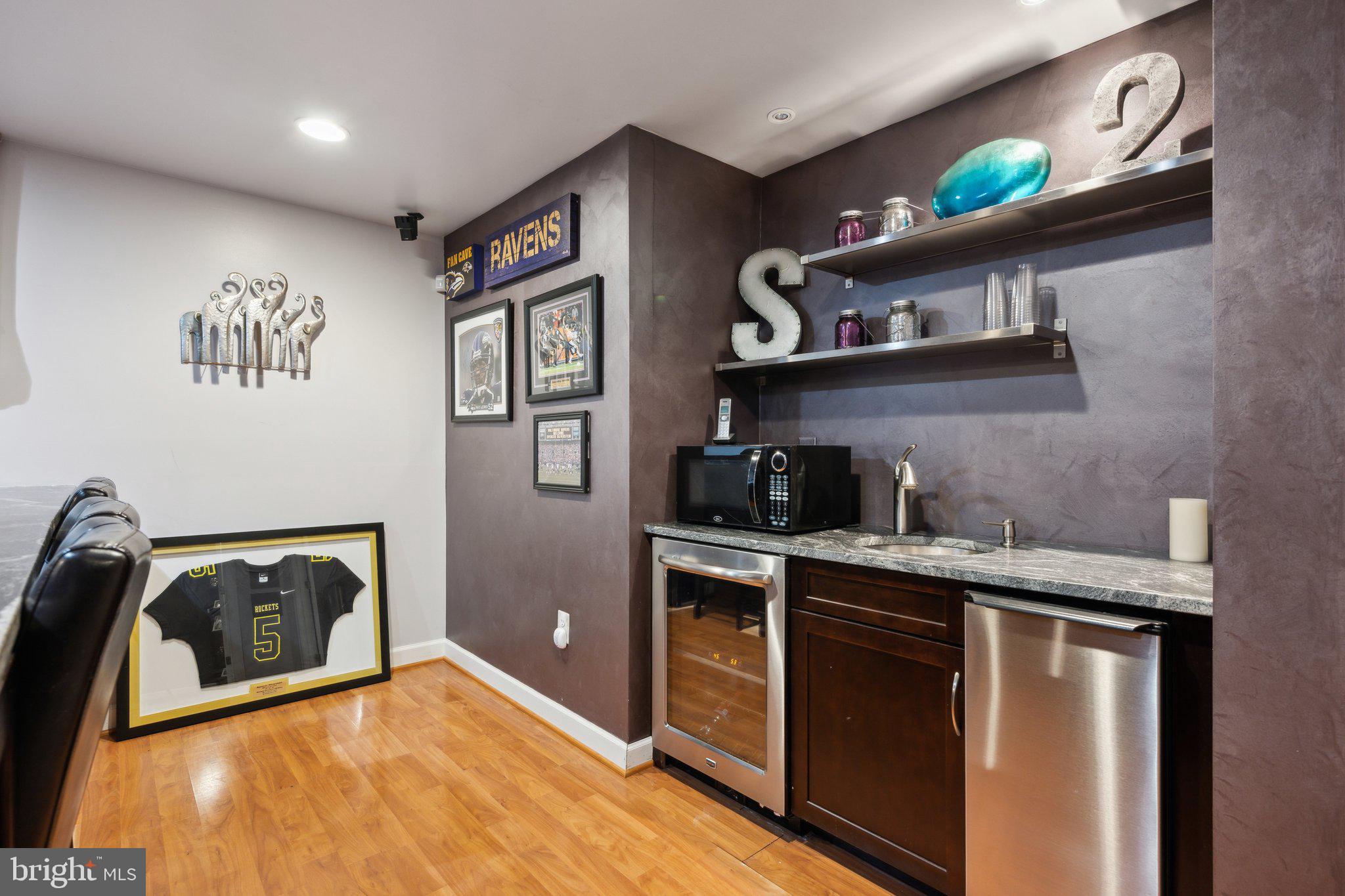 304 Thompson Dairy Way Rockville, MD 20850 - Photo 30 of 42 a kitchen with stainless steel appliances granite countertop a stove a sink and a microwave