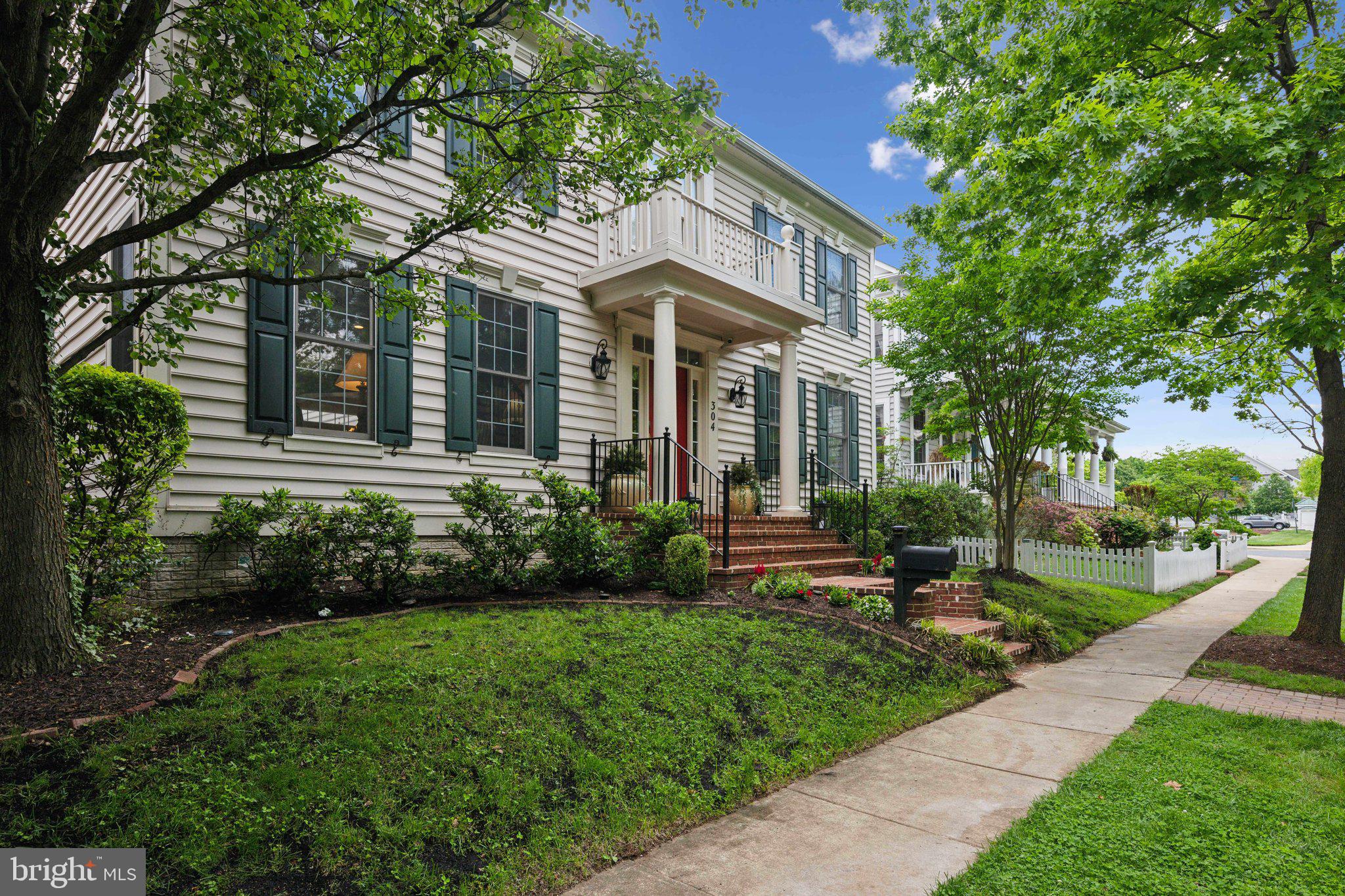 304 Thompson Dairy Way Rockville, MD 20850 - Photo 3 of 42 a front view of a house with a yard