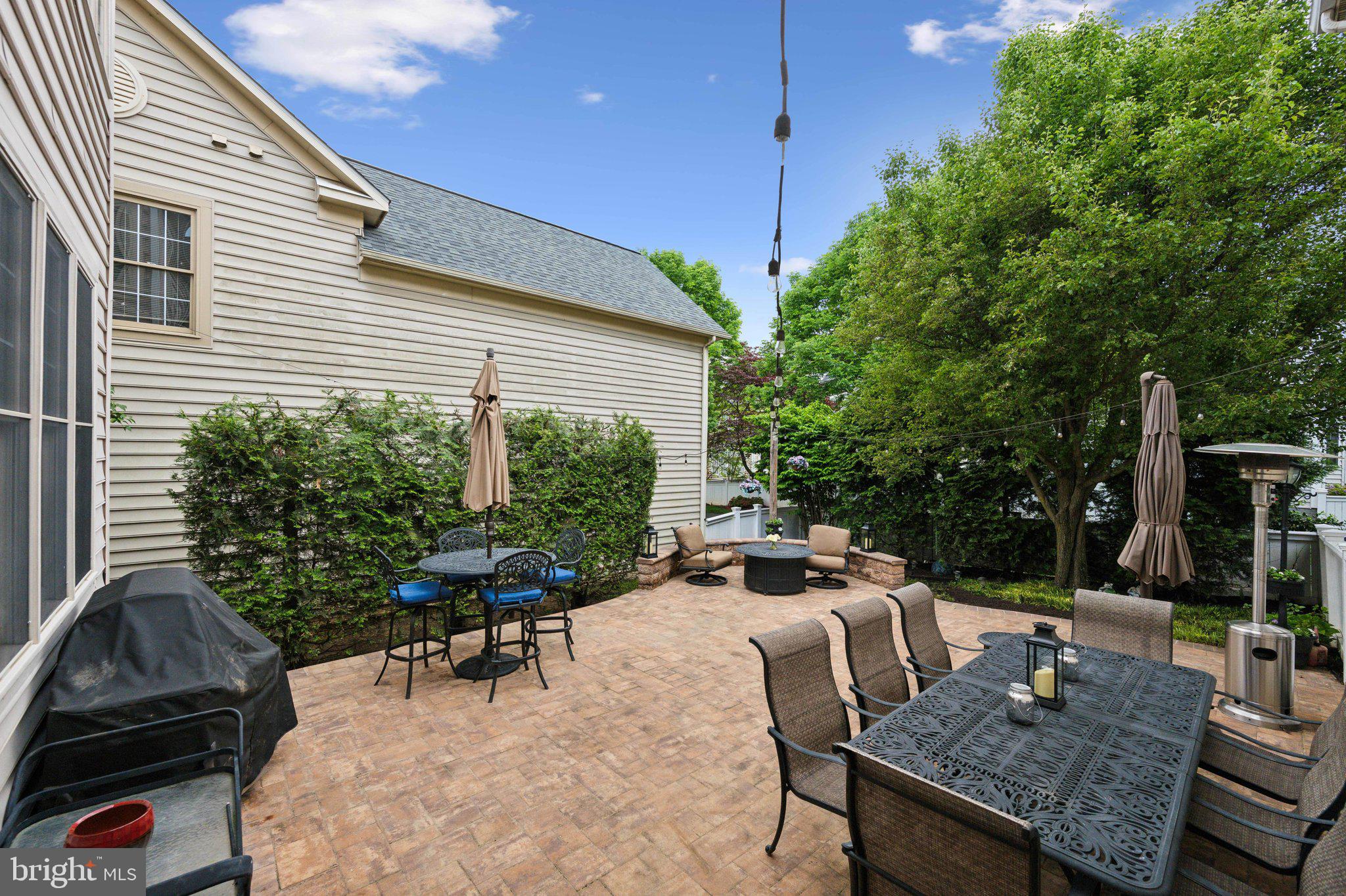 304 Thompson Dairy Way Rockville, MD 20850 - Photo 33 of 42 a view of a patio with table and chairs and potted plants