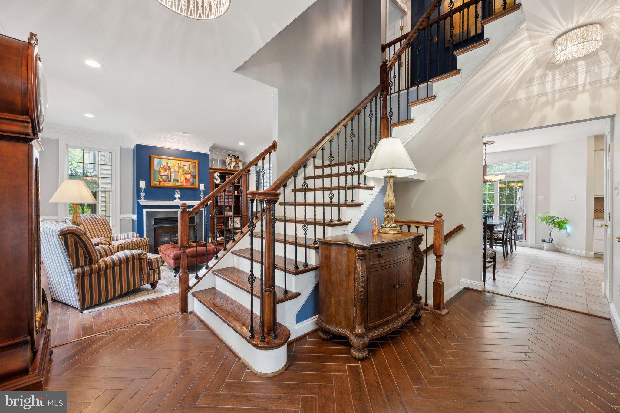 304 Thompson Dairy Way Rockville, MD 20850 - Photo 5 of 42 a living room with furniture wooden floor and a chandelier
