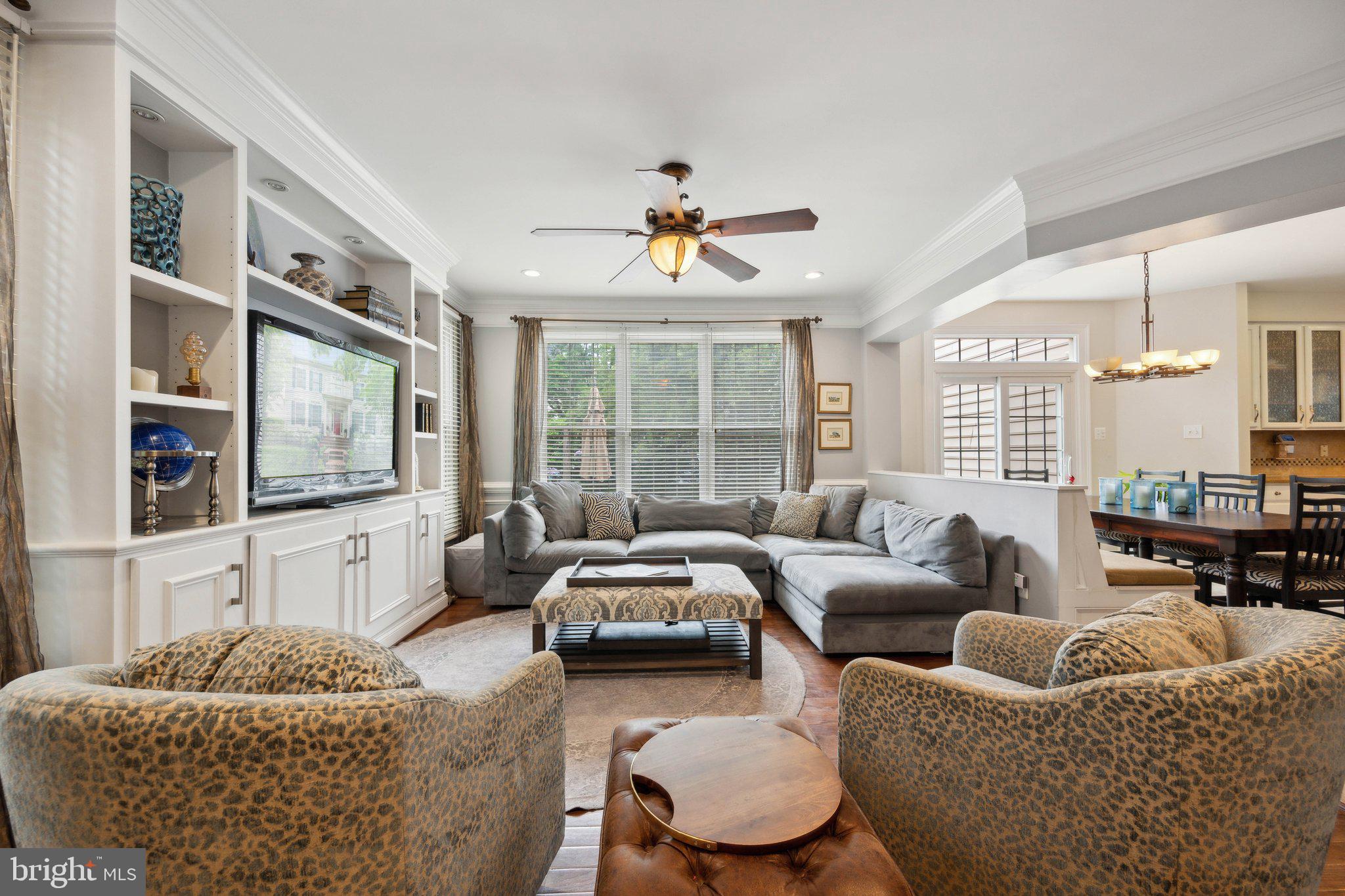 304 Thompson Dairy Way Rockville, MD 20850 - Photo 9 of 42 a living room with furniture ceiling fan and a window