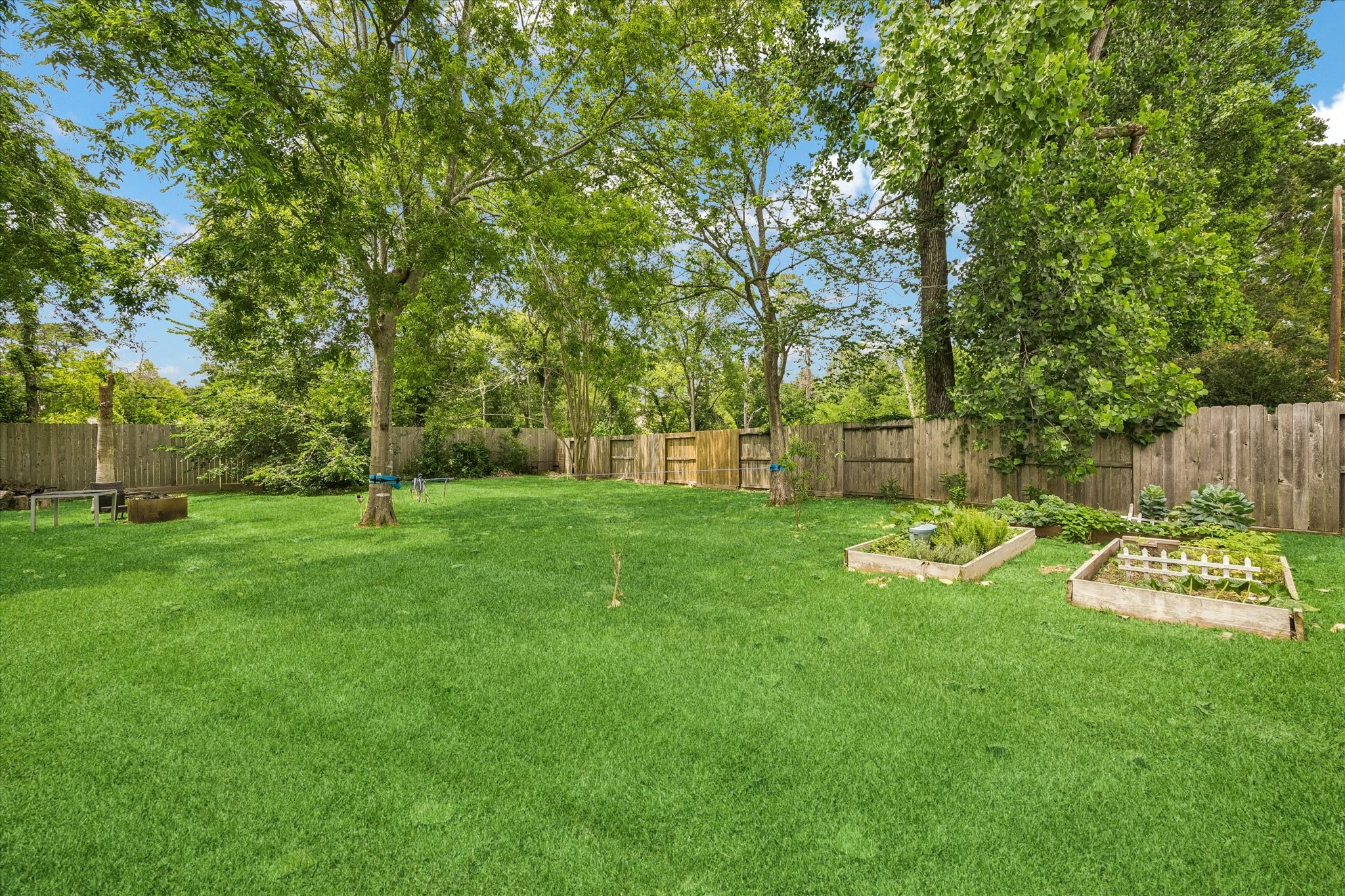 9110 Rhapsody Lane Houston, TX 77040 - Photo 19 of 20 Beyond the pool, you will find plenty of grass space for additional landscaping, gardening and or a putting green! Your backyard landscape is waiting for you!