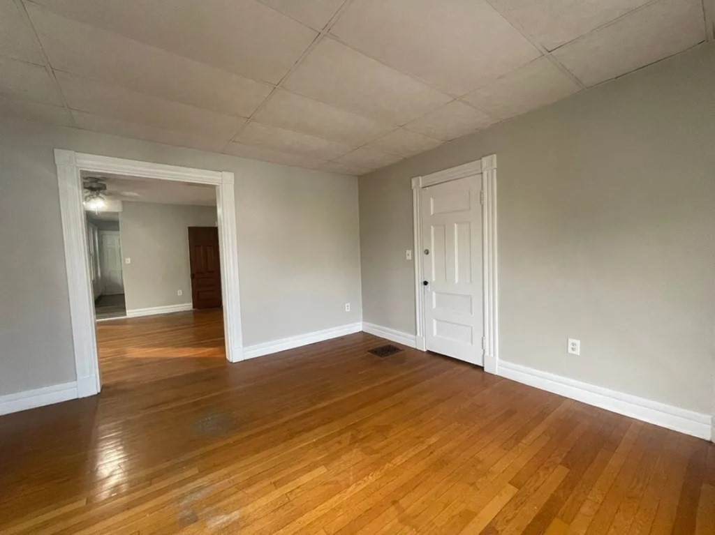 38 Rutledge Avenue Springfield, MA 01105 - Photo 12 of 23 a view of an empty room and wooden floor