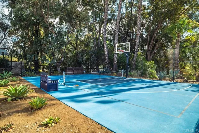 a view of a house with backyard sitting area and swimming pool
