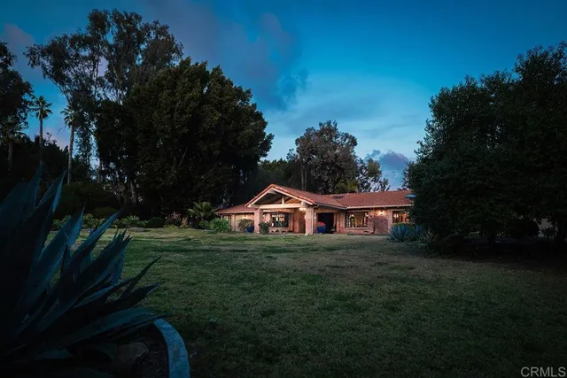 a view of a swimming pool with an outdoor seating