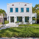 a view of a house with a yard and plants