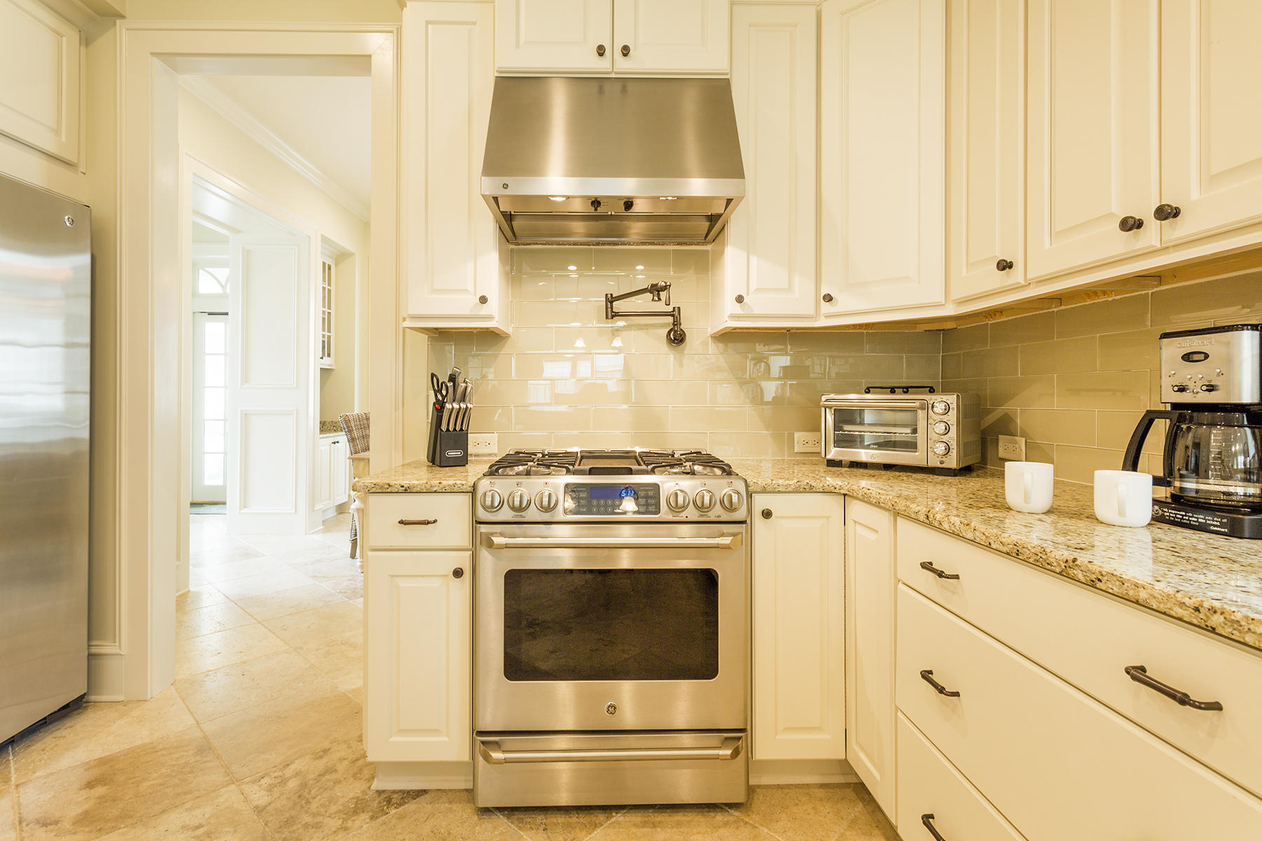 40 Pleasant Street Inlet Beach, FL 32461 - Photo 8 of 47 a kitchen with granite countertop white cabinets and white appliances