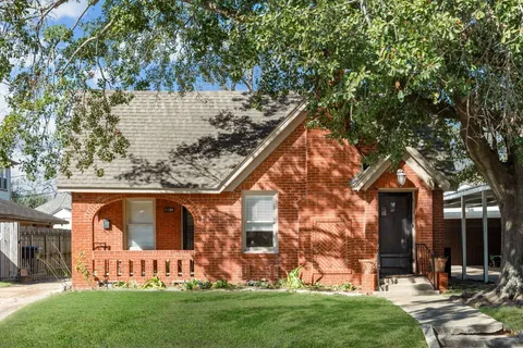 front view of house with a yard