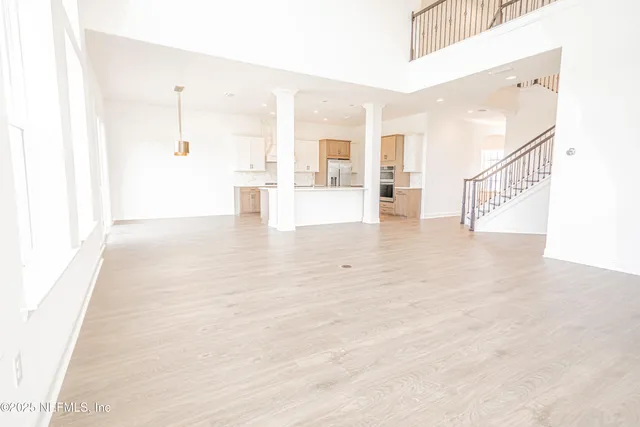 a view of an entryway with wooden floor