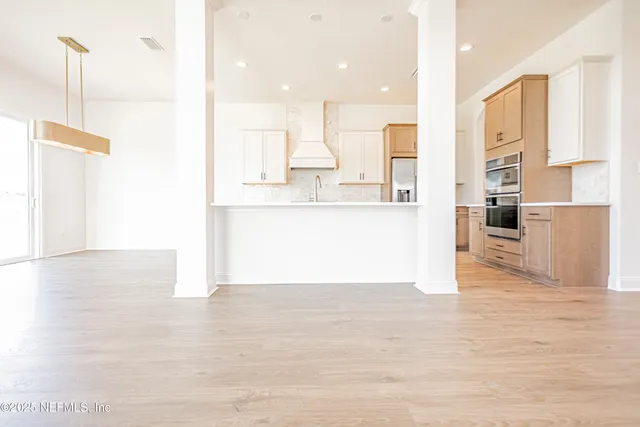 a view of kitchen with wooden floor