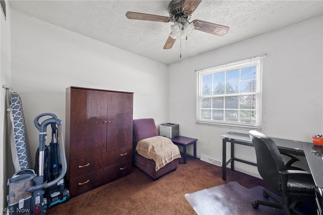 439 South Miller Road Akron, OH 44313 - Photo 24 of 31 Bedroom featuring a textured ceiling, ceiling fan, and carpet flooring
