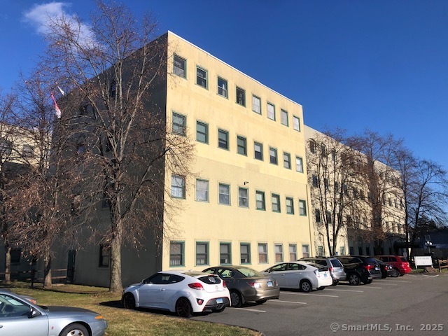 a city street lined with buildings and cars