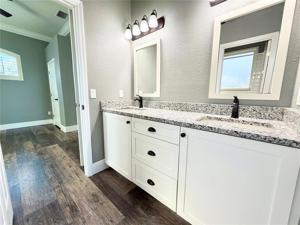 5243 West Lake Butler Road Windermere, FL 34786 - Photo 26 of 43 a bathroom with a granite countertop sink mirror and a