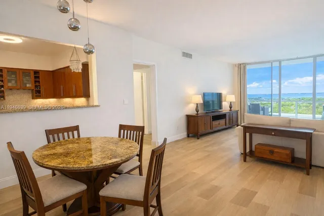 a view of a livingroom with furniture and a table