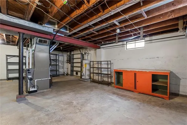 a view of an empty room with wooden roof