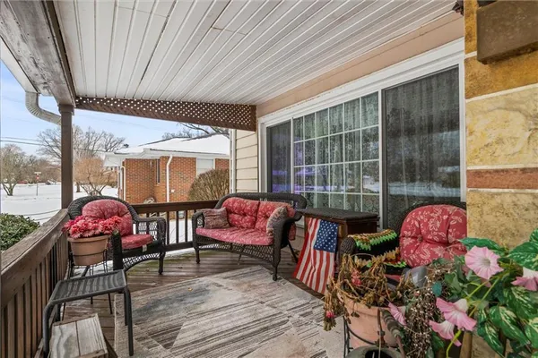 a outdoor space with lots of furniture and outdoor seating