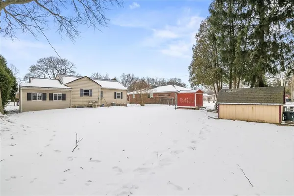 a front view of a house with yard