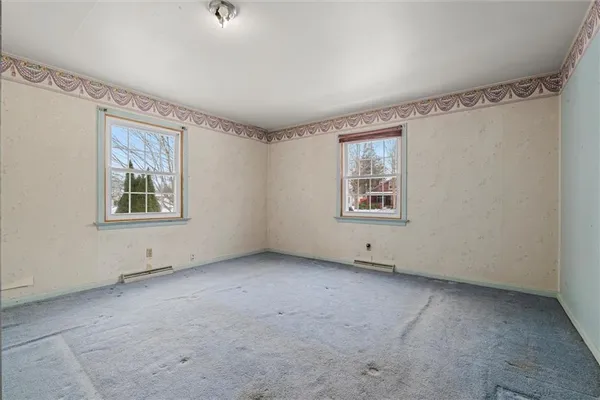 an empty room with windows