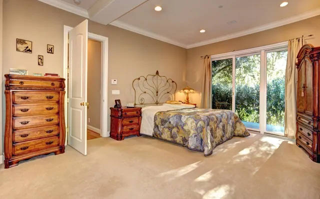 a bedroom with a bed and a walk in closet