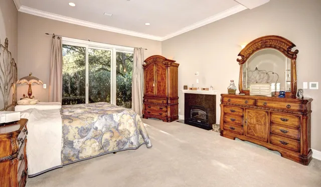 a spacious bedroom with a bed and a dresser