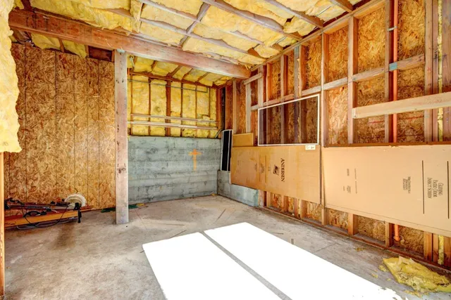 a view of a brick house with many windows