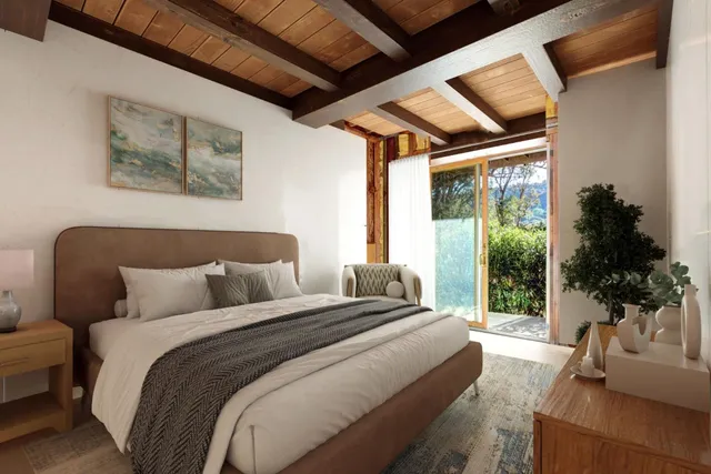 a bedroom with bed and a large window with garden view