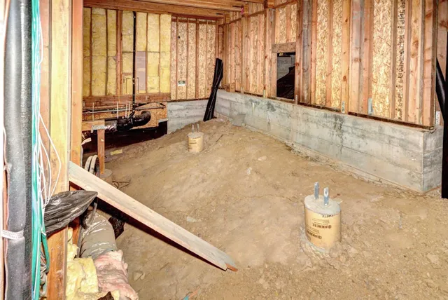 a view of a living room with a floor to ceiling window and floor to ceiling window