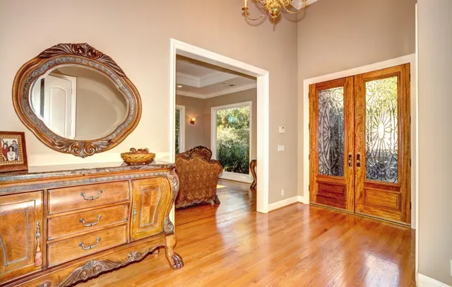 a view of a livingroom with furniture wooden floor and a rug