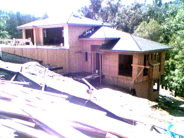 a couple of cars parked in front of a house