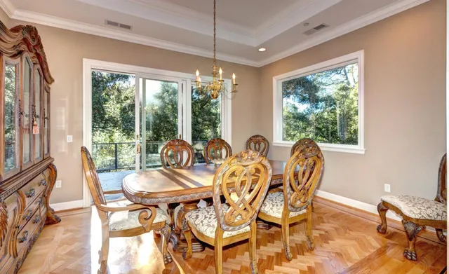 a view of a dining room with furniture window and outside view