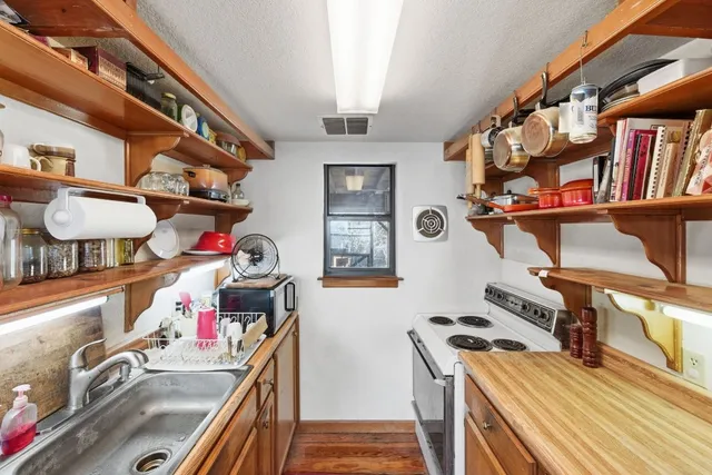 a view of gym equipment and kitchen view