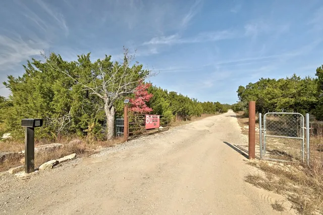 a view of a street with a building in the background