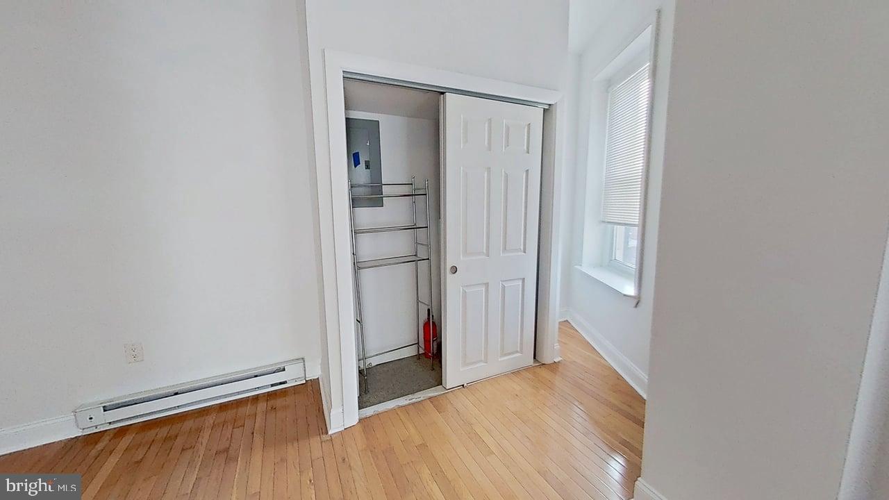 1234-40 Rising Sun Avenue, Unit D Philadelphia, PA 19140 - Photo 4 of 11 a view of empty room with wooden floor