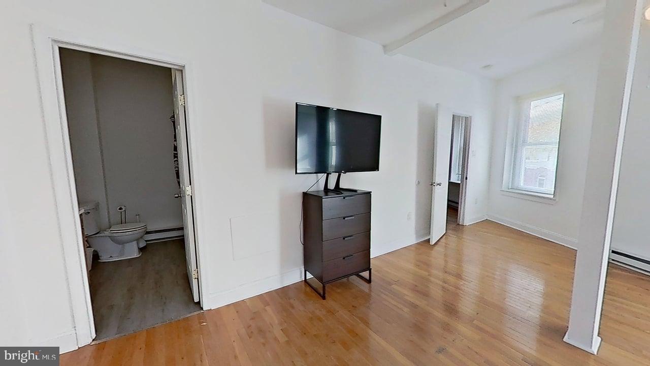 1234-40 Rising Sun Avenue, Unit D Philadelphia, PA 19140 - Photo 8 of 11 a view of a workspace with furniture and a window