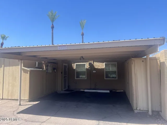 a view of a house with a door and a ceiling fan