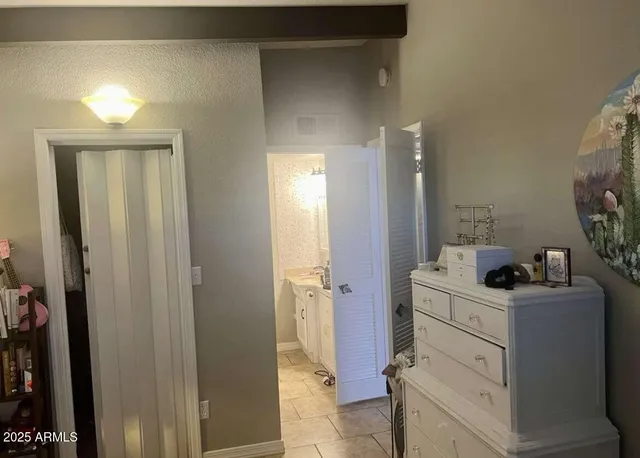 a bathroom with a sink vanity toilet and shower