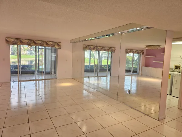 a bathroom with a glass door shower