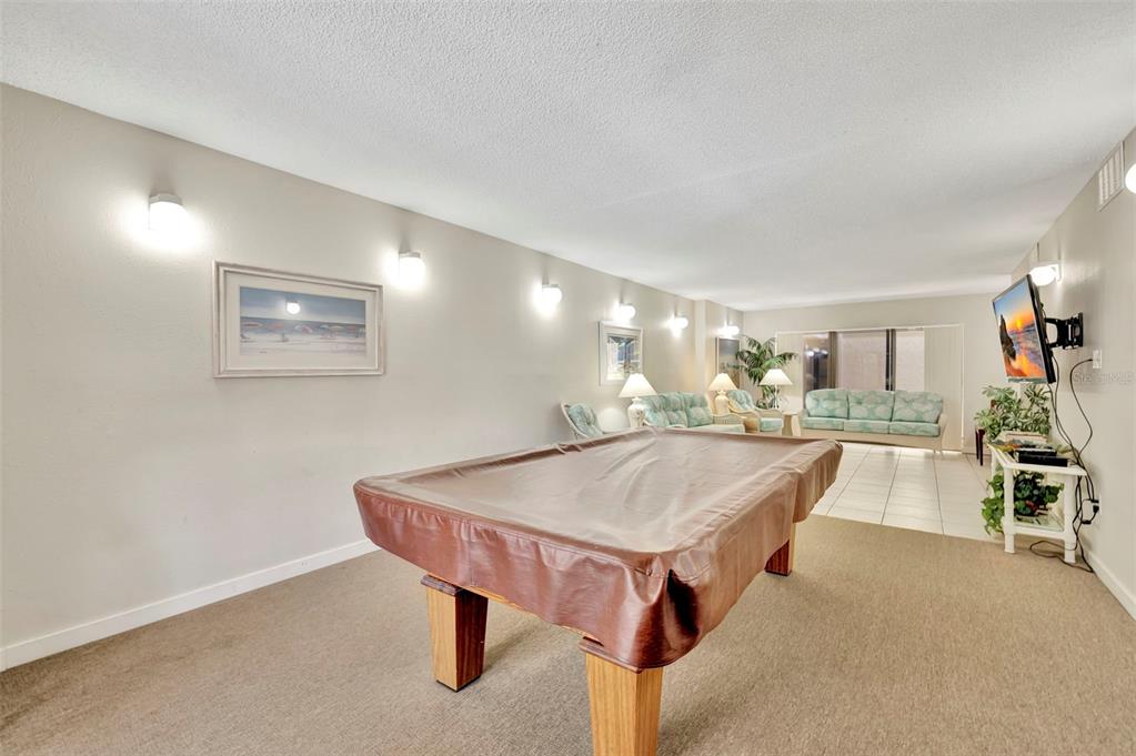 6157 Midnight Pass Road, Unit E24 Sarasota, FL 34242 - Photo 29 of 44 a view of a dining room with furniture