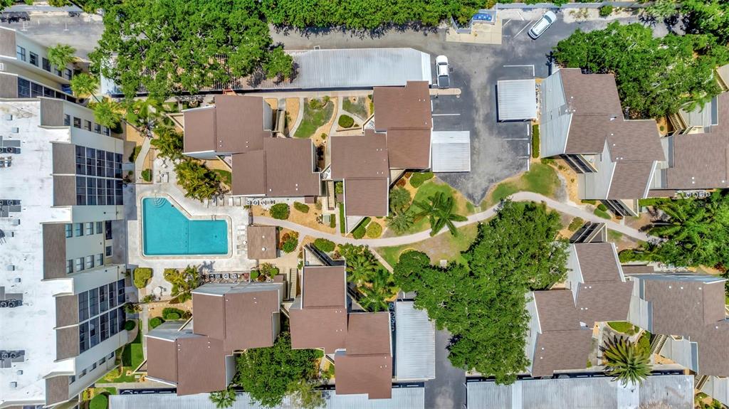 6157 Midnight Pass Road, Unit E24 Sarasota, FL 34242 - Photo 39 of 44 an aerial view of residential houses with outdoor space