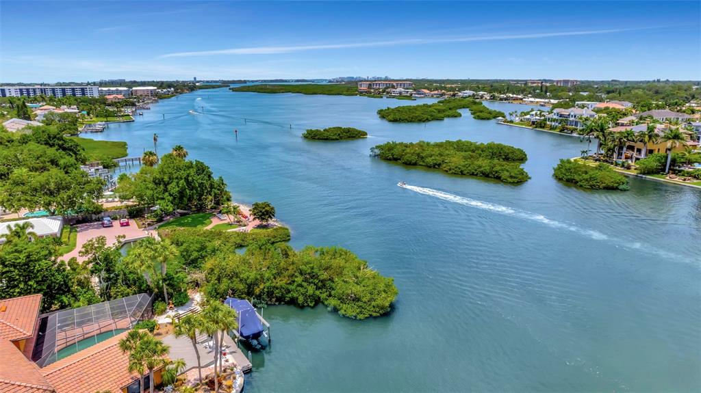 6157 Midnight Pass Road, Unit E24 Sarasota, FL 34242 - Photo 41 of 44 an aerial view of a houses with outdoor space