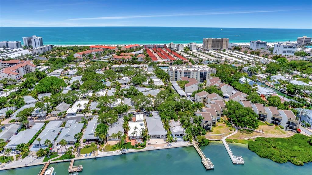6157 Midnight Pass Road, Unit E24 Sarasota, FL 34242 - Photo 43 of 44 an aerial view of multiple house
