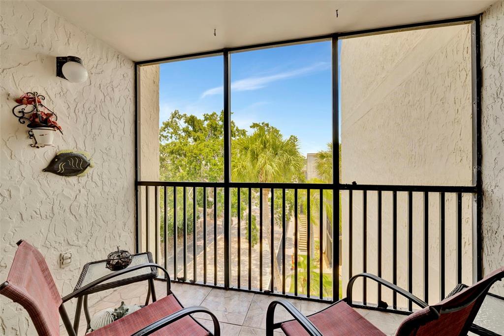 6157 Midnight Pass Road, Unit E24 Sarasota, FL 34242 - Photo 9 of 44 a view of a balcony