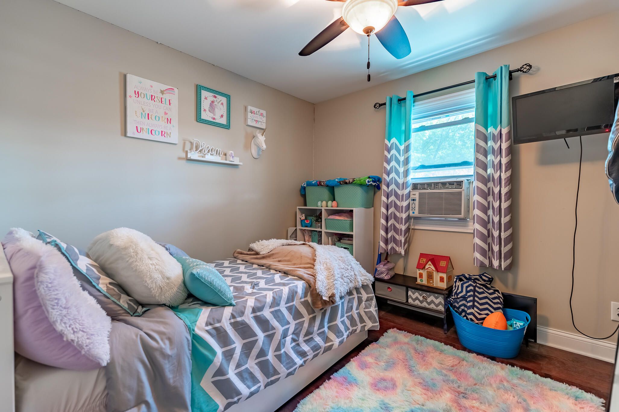 14615 Reeder Road Crown Point, IN 46307 - Photo 11 of 26 a bedroom with a bed and a chandelier