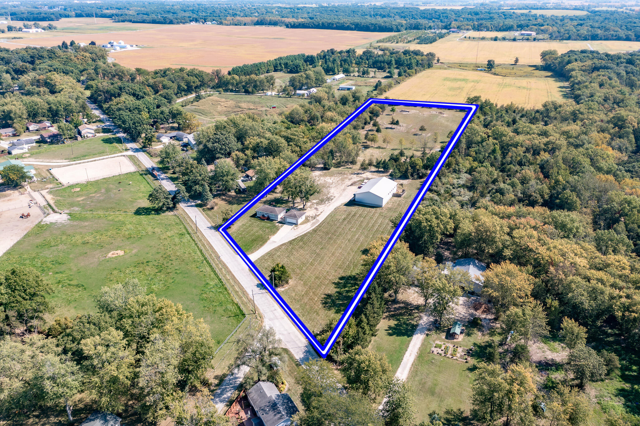 14615 Reeder Road Crown Point, IN 46307 - Photo 2 of 26 a view of swimming pool with a garden and a wooden bench