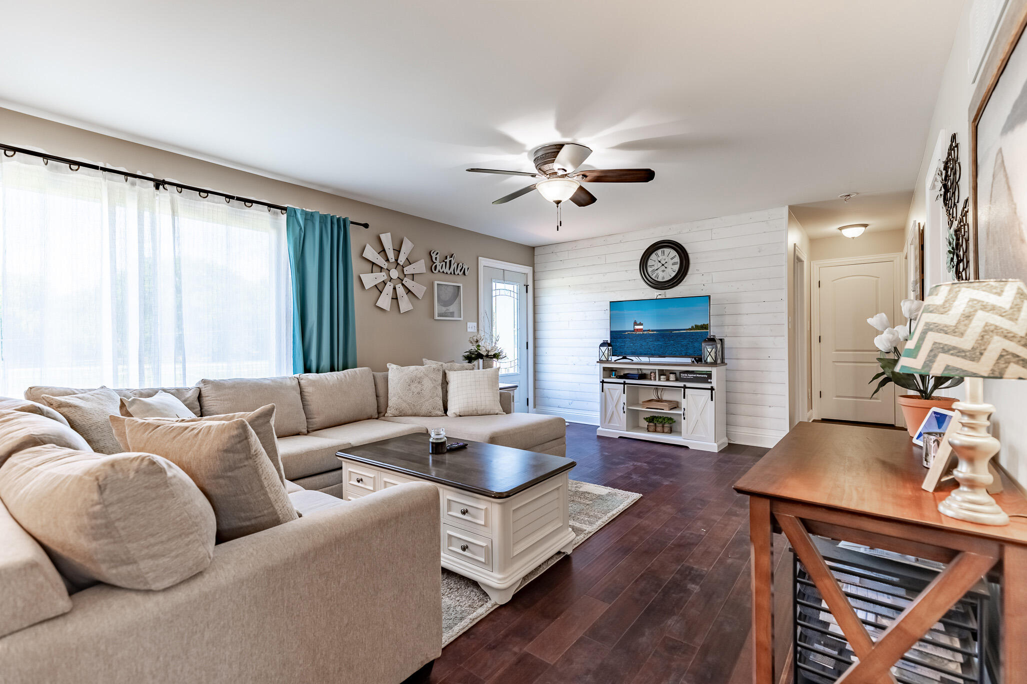 14615 Reeder Road Crown Point, IN 46307 - Photo 6 of 26 a living room with furniture a large window and a clock
