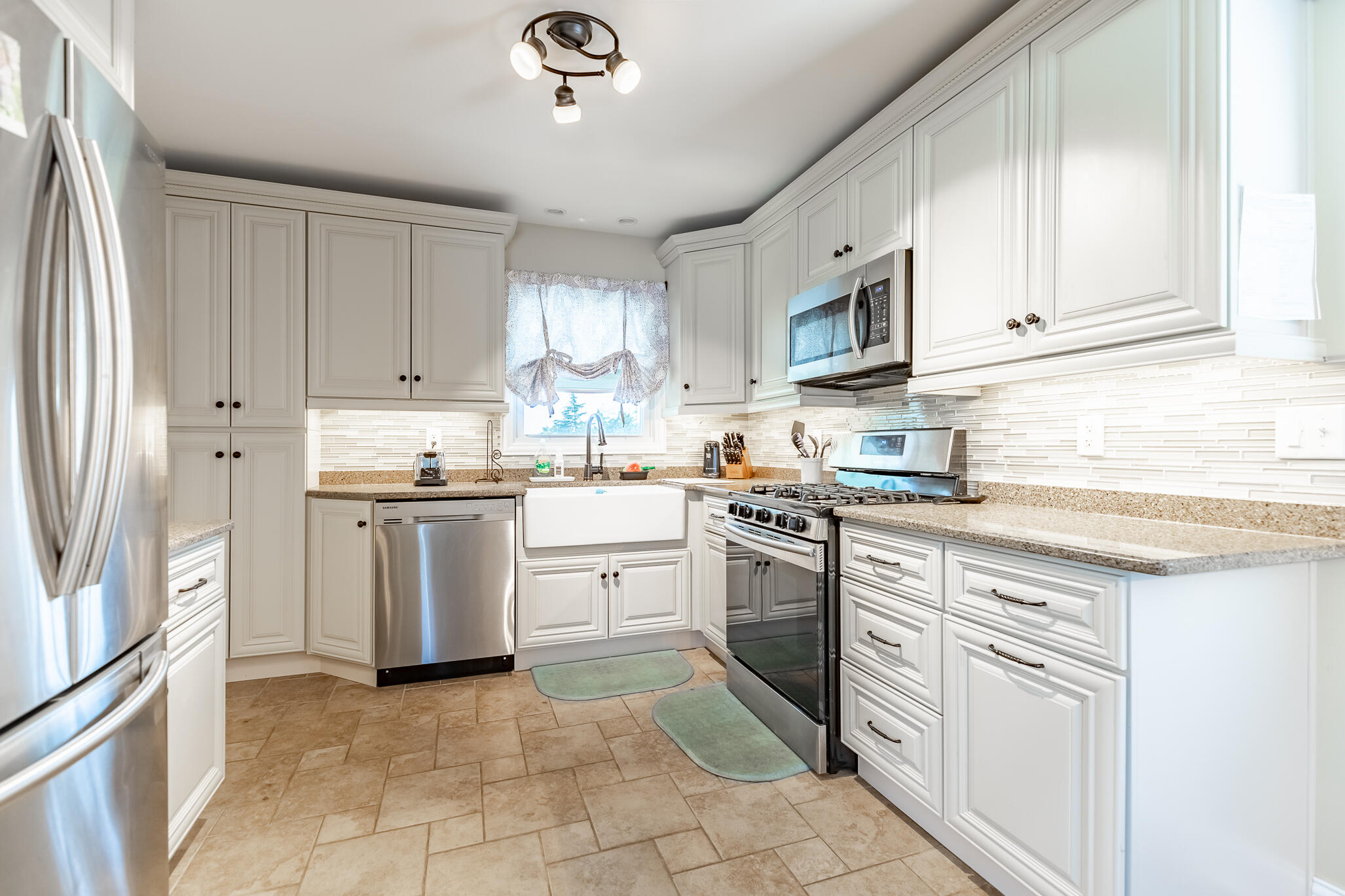 14615 Reeder Road Crown Point, IN 46307 - Photo 8 of 26 a kitchen with granite countertop white cabinets and stainless steel appliances